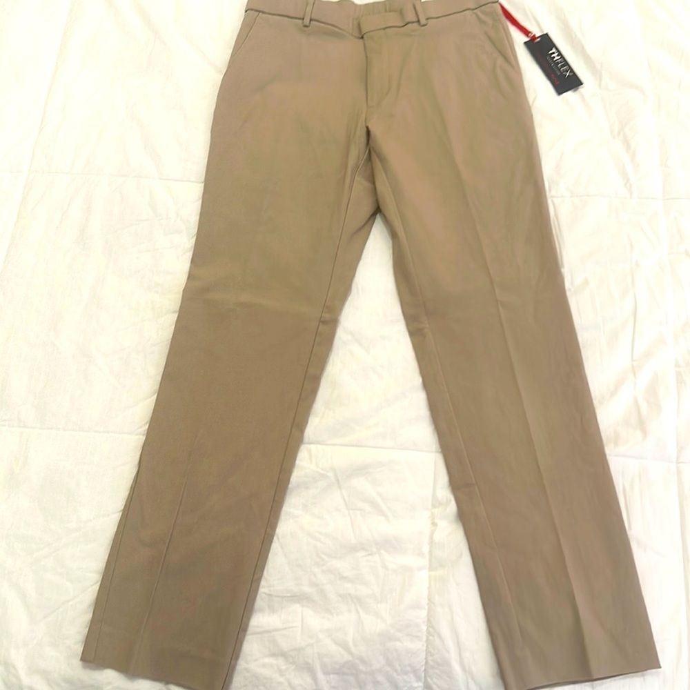 Tommy Hilfiger men’s slacks. W32 L30 brand new. Stretch fit tailored to move.